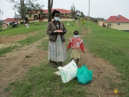 Kobusinge Rinnah's family with their food package (2)