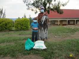 Mwandara Elvis' family with their food package (3)