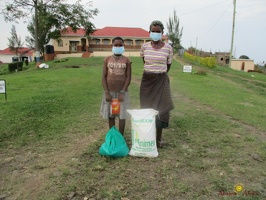 Nyakato Edith's family with their food package (1)