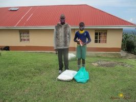 Musinguzi Gerald's family with their food package (1)