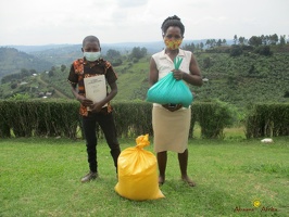 Tugume John's family with their food relief (2)