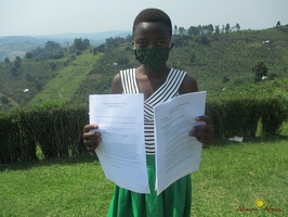 Karungi Cecilia with her home study work (5)